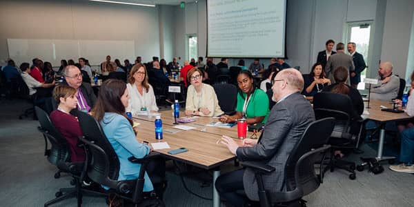 people grouped by tables